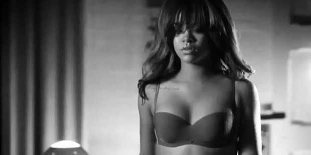 Rihanna as she appears in her raunchy Armani campaign. Photo / YouTube