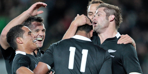 Players congratulate Julian Savea after he crossed the line for one of this three tries on debut.. Photo / Brett Phibbs