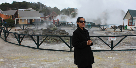 A guide at Whakarewarewa introduces visitors to the steaming cauldrons that naturally cook food at temperatures of up to 250 degrees. Photo / Paul Rush