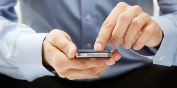 In Britain, some bank customers can use their smartphones to withdraw up to £100 from an ATM via a password protected app. Photo / Thinkstock