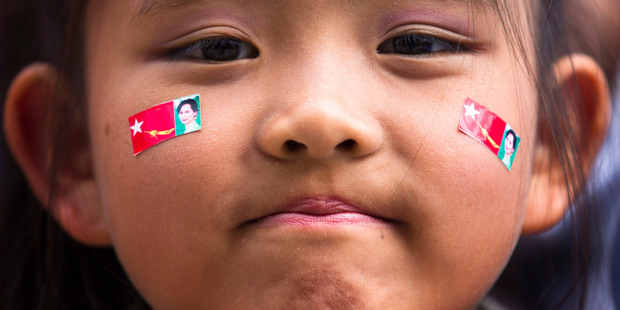 A girl with pictures of Myanmar opposition leader Aung San Suu Kyi stickers on her face attend a concert to honor Suu Kyi after her speech at the Peace Nobel Prize lecture at the city hall in Oslo. Photo / AP