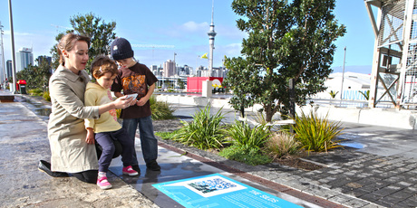 Using the new QR codes and signs installed by Waterfront Auckland from The Cloud to the silos at Wynyard Quarter. Photo / Supplied