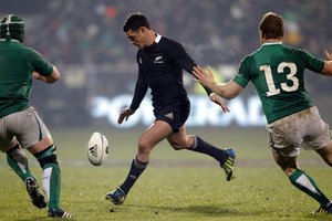 Dan Carter attempts a drop kick, but was charged down. Photo / Getty Images.