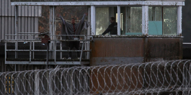 Notorious escaper and fellow inmate pose no threat to the community, say Corrections officials The disused security tower at Paremoremo has been cordoned off since the two prisoners were spotted. Picture / Getty Images.