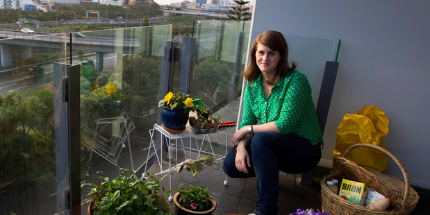 Student Jennifer Parlane with her garden balcony in inner-city Auckland. Photo / NZ Herald