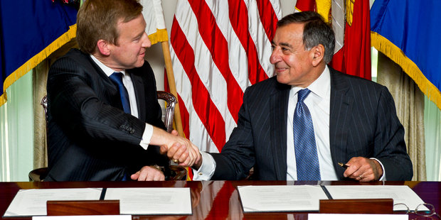 Defence Minister Jonathan Coleman and US Secretary of Defence Leon Panetta (right) seal the new agreement in Washington. Photo / Supplied