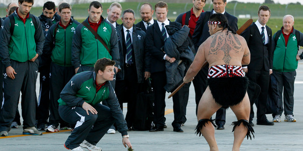 Hamilton prepares for biggest weekend of the year as Irish team and fans arrive Ireland's captain Brian O'Driscoll accepts the challenge at a powhiri in Hamilton yesterday. Picture / Christine Cornege.