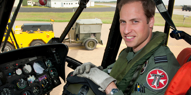 Britain's Prince William in the cockpit of a helicopter, earlier in June. The Prince celebrates his 30th birthday, and is set to inherit from his mother, Diana. Photo / British Defence Ministry