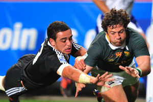 Vian van deer Watt of South Africa scores in the corner despite the efforts of Bryn Hall.
Photo / File