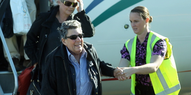 A helping hand for Paul Holmes as he arrives in Napier yesterday. Photo / APN