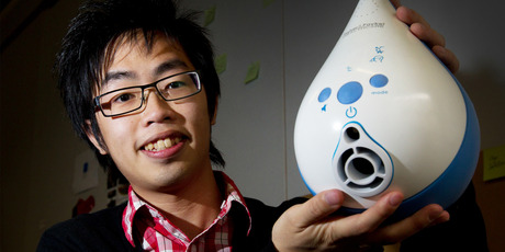 AUT student Mark Wu with a medical humidifier prototype developed for Fisher and Paykel Healthcare. Photo / Sarah Ivey