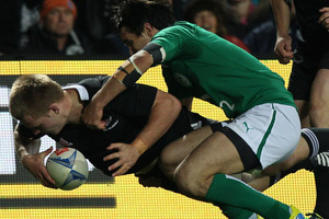 Sam Cane of New Zealand (bottom L) scores a try as he is tackled by Conor Murray of Ireland (C) during their third and final rugby union Test match at Waikato Stadium. Photo / Getty Images.