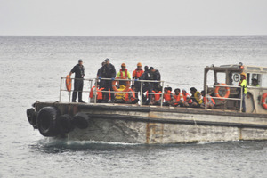A barge delivers some of those rescued to Christmas Island.
Photo / Getty Images
