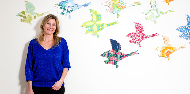 Artist Mariee Guinibert photographed with the flying ducks she sells at the monthly MoAD Design Markets. Photo / Babiche Martens
