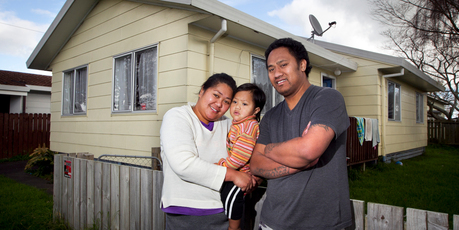Taleni Nouata with her partner Pio Lafo and son TJ Lafo (2) outside their state house in Papakura. Photo / Natalie Slade