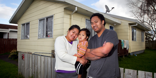 Taleni Nouata with her partner Pio Lafo and son TJ Lafo (2) outside their state house in Papakura. Photo / Natalie Slade