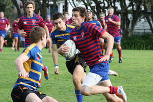Daniel Lee, Rosmini College hurtles past Logan O'toole and Toby Edgar of Takapuna Grammar during Rosmini's 39-10 win. Photo / Supplied