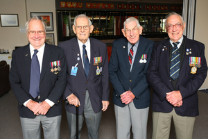World War II air veterans (from left) Ernest Davenport, Harry Furner, Wally Halliwell and Harry Cammish, pay their respects at Whenuapai. Below: An artist's impression of the London memorial. Photo / Chris Gorman.