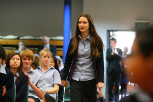 Tayla Young, 13, of Rangitoto College reacts with shock as she is named the New Zealand Flag Envoy to the London Olympics. Picture / Chris Gorman.