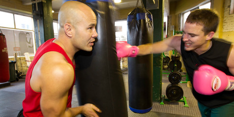 Reporter Nicholas Jones is put through Jaime Ridge's boxing workout by trainer Monty Betham. Photo / Richard Robinson