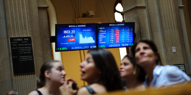 Screens at The Stock Exchange in Madrid show figures for the Spanish bank Bankia. Photo / AP