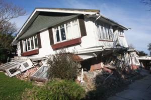 A condemned house with a cracked roof may well let in more light than a frost encrusted car on a Christchurch street. Photo / Geoff Sloan