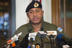 Commodore Frank Bainimarama has attended a ceremony marking the launch of an electronic voter registration machine ahead of the country's 2014 elections. Photo / Greg Bowker