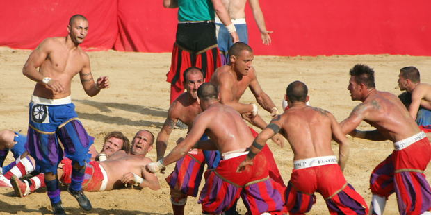 Every year, 54 men strip off their shirts and prepare to be pounded in the football game of Calcio Storico in Florence. Photo / Creative Commons image by Wikimedia user Lorenzo Noccioli