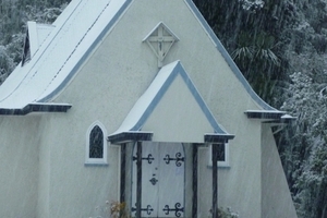 Our Lady of the Alps church at Franz Josef Glacier lived up to its name this morning. Photo / Supplied