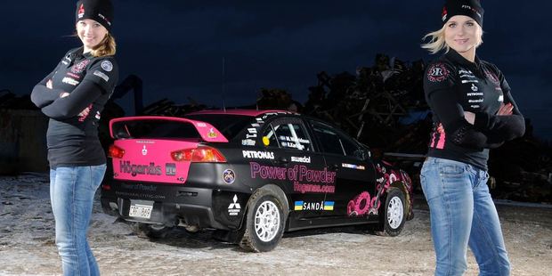 Ramona Karlsson and co-driver Miriam Walfridsson with the Mitsubishi that burnt during Rally New Zealand yesterday.