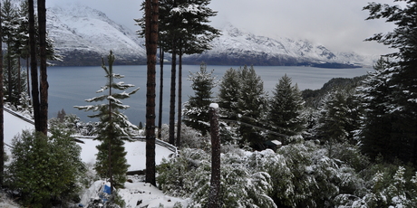Snow seen over Lake Wakatipu off Glenorchy Road just after 10am this morning. Photo / Carman Hagen
