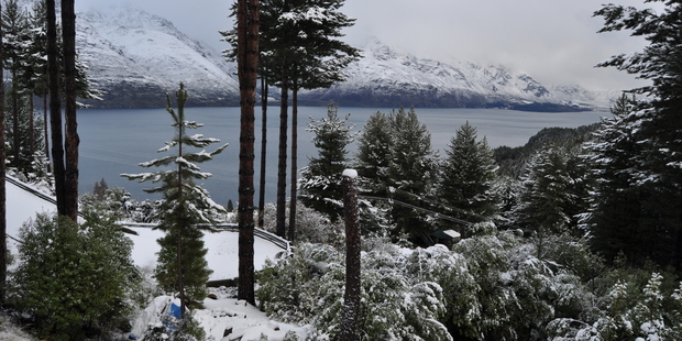 Snow seen over Lake Wakatipu off Glenorchy Road just after 10am this morning. Photo / Carman Hagen