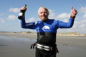 British tycoon Richard Branson, 61, celebrates on July 1, 2012 in Wimereux, northern France, after he succeeded in crossing the English Channel. Photo / AFP