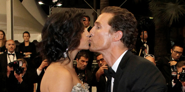 Camila Alves, left, and Matthew McConaughey kiss as they depart after a film screening at the 65th international film festival, in Cannes, earlier this year. Photo / AP
