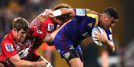 Siale Piutau of the Highlanders attempts to break free from the defence during the round 17 Super Rugby match between the Reds and the Highlanders. Photo / Getty Images.