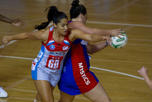 Mystics goal shoot Catherine Latu (right) snatches the ball from the Swifts' Mo'onia Gerrard in their tight tussle in Auckland last night. Photo / Sarah Ivey
