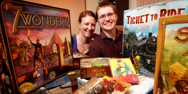 David and Angela Taylor with some of the board games they sell from their home in Papamoa. Photo / Alan Gibson