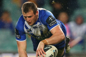 Josh Morris scores for the Bulldogs. Photo / Getty Images