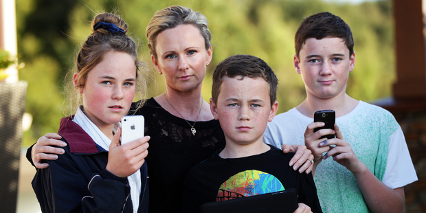 Pictured are Jodie Ahern with her children, Gia, Nathan and Luke Hughes.
Photo / Doug Sherring