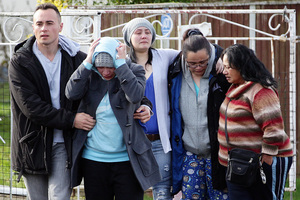 Richard Tairua's grieving relatives at the scene. Photo / Doug Sherring