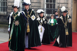 Britain's Queen Elizabeth II, centre, accompanied by Prince Philip, Princess Anne, left, and the Prince William, Duke of Cambridge attend the Thistle Service at St Giles' Cathedral. Photo / AP