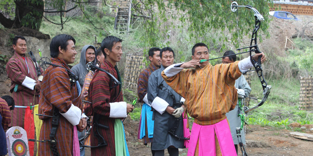 A Bhutanese archery tournament in full swing. Photo / Jill Worrall