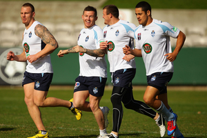 Luke Lewis, Todd Carney, Josh Morris and Jarryd Hayne warm up during a New South Wales Blues State of Origin training session. Photo / Getty Images