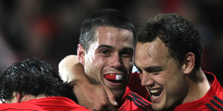 Sean Maitland (C) of the Crusaders is hugged by team mates Zac Guildford (L) and Israel Dagg (R) after scoring a try during the round 18 Super Rugby match. Photo / Getty Images.