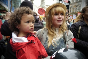 Minke Botes and 2-year-old Luca Namoa join 3000 protesters in Auckland City. Photo / Jason Dorday