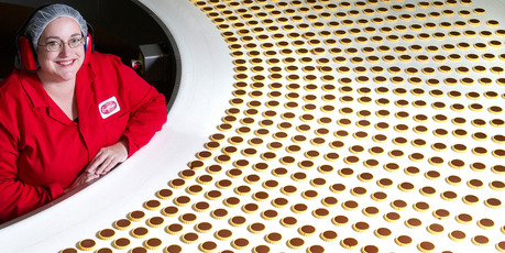 Amber Johnson watches the first batch of Choco-ades since the early 1990s roll along the production line. Photo / Supplied