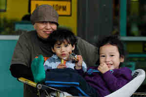 Te Amohia McQueen shops carefully with two of her children, Shyloh Tahere (left) and Maniapuhi Tahere. Picture / Christine Cornege.