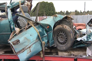 The tourists hit a truck as they tried to pass within 50m of a bend, killing four of them and critically injuring one. Photo / One News