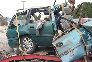 The force of the head-on collision in which the four South American men died ripped the engine from their car and crushed its roof. Photo / One News