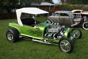 Iridescent green paint with lace flames, chrome plating throughout and an exposed Ford V8 engine make Vandal - built in the late 1960s - a star of the hot rod display at Speedshow. Photo / Greg Stokes, NZ Hot Rod Magazine